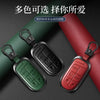 A set of multi-colored leather and metal car key cases for Jeep models displayed on a dark background.