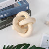 A handcrafted rustic wood knot decor piece used as a boho coffee table accent.