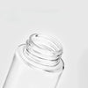 Clear glass refillable fine mist spray bottle with a silver cap
