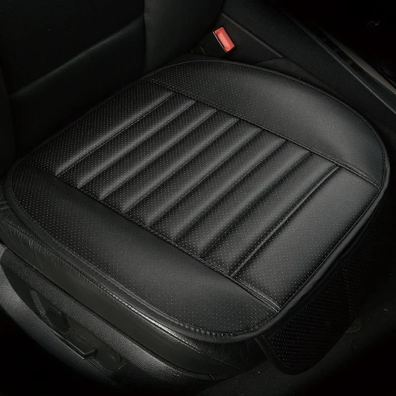 Black breathable PU leather car seat cover with quilted texture and stitching.