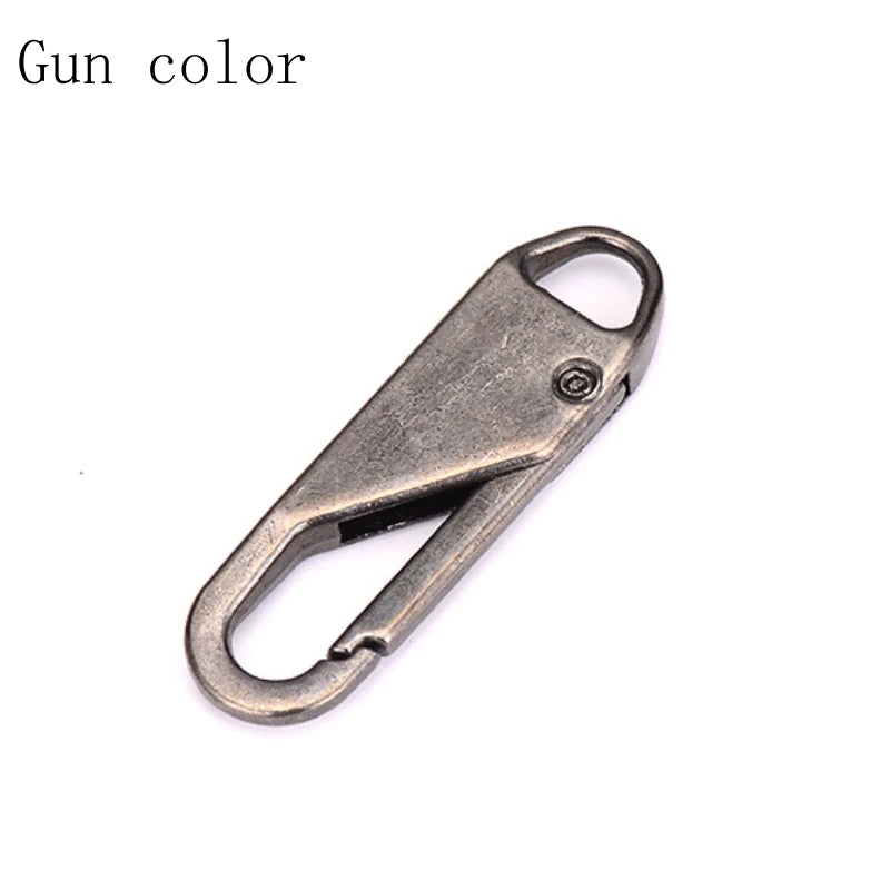 A close-up view of a metal zipper pull or slider repair component.