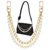 Elegant pearl and gold purse chain featuring a black quilted leather pouch.
