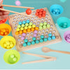 A wooden bead maze puzzle with colorful beads and wooden tools is shown on a light blue background.