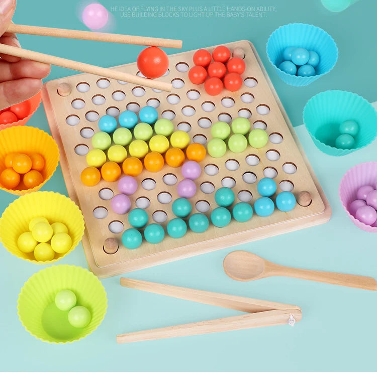 A wooden bead maze puzzle with colorful beads and wooden tools is shown on a light blue background.