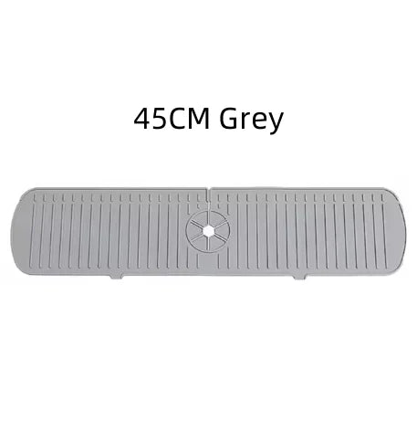 A grey silicone faucet drain mat with ridges and a central drain hole.