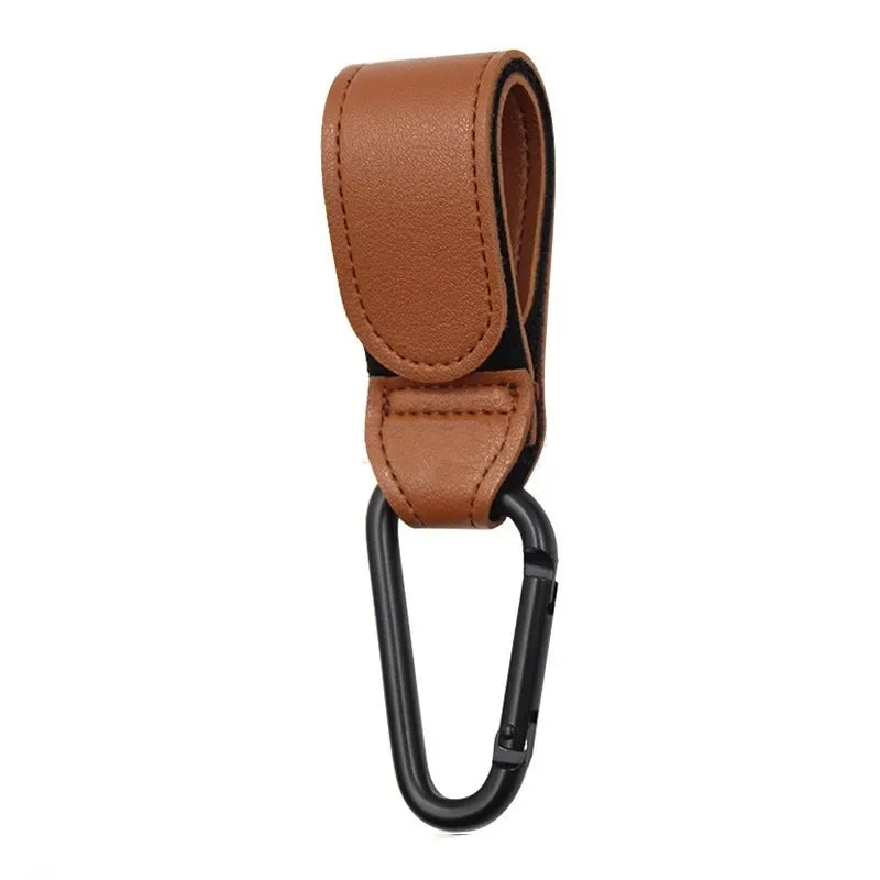 Brown PU leather stroller hook and baby bag organizer with a black strap