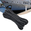 A thick black double braid nylon dock line coiled and laid out for boating use.