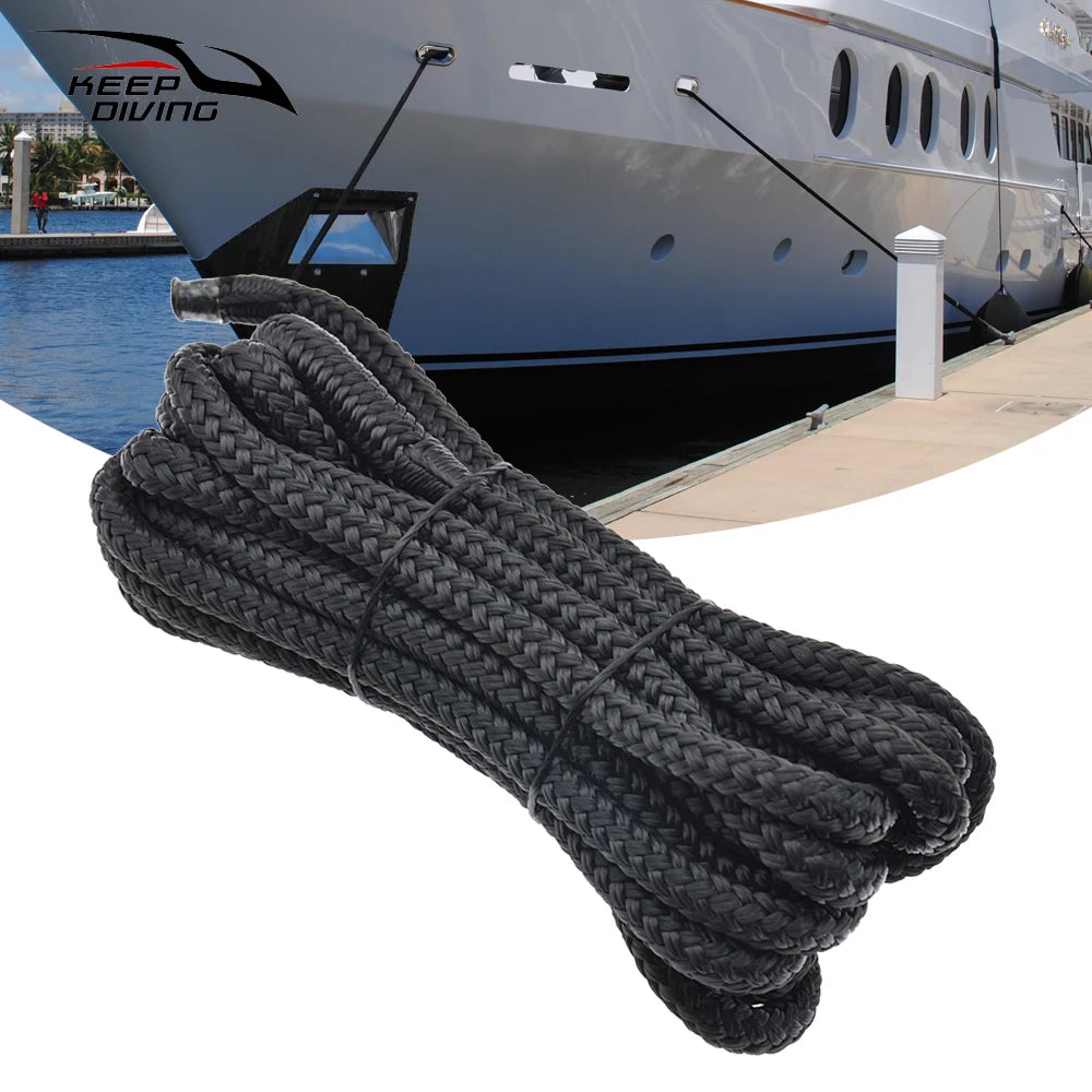 A thick black double braid nylon dock line coiled and laid out for boating use.