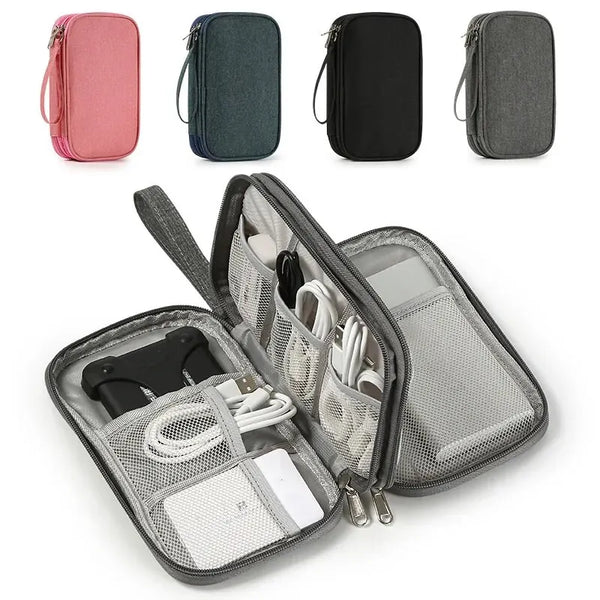 A set of travel digital organizer bags in pink, dark blue, black, and gray, with an open bag showing various cables and acces