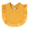 A mustard yellow, textured cotton baby bib in a bandana style with ruffled edges.