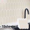 A display of ten sheets of premium thick peel-and-stick 3D backsplash tiles in a light beige color against a tiled wall backg