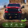 A red Ford F-150 pickup truck is shown in a desert environment with silicone tow hook covers displayed below.