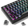 A close-up view of a black mechanical keyboard with crystal clear RGB backlit keycaps and various modifier keys.
