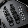 Black heavy-duty quick release shovel holder with mounting hardware displayed on a dark surface