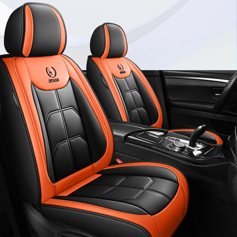 Black and orange leather car seat covers with stitching and design accents shown in a car interior.