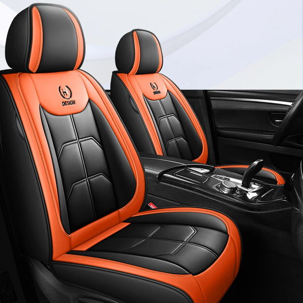 Black and orange leather car seat covers with stitching and design accents shown in a car interior.
