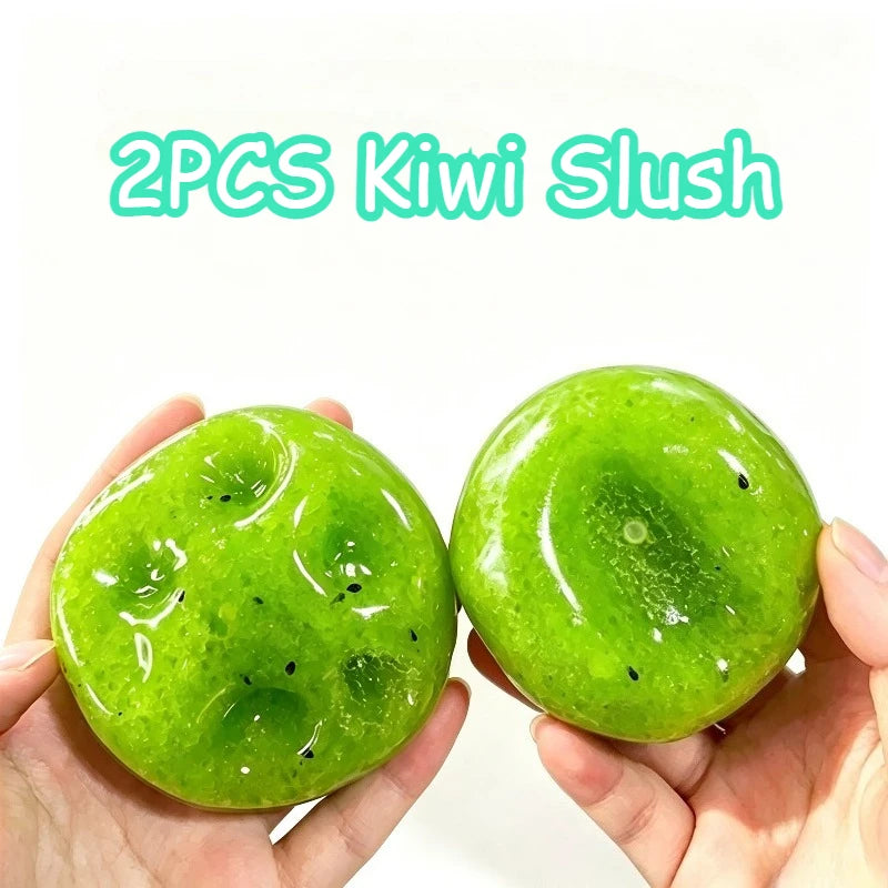 Two bright green kiwi slush squishy balls held in a person's hand