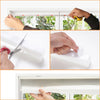 Hands adjusting no-drill pleated window blinds using adjustable clips and a measuring tape.