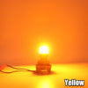 A yellow LED bulb is shown with a wire, illuminated against an orange background.