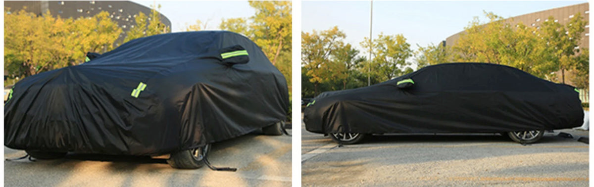 A black all-weather car cover is shown covering an SUV and a sedan outdoors.