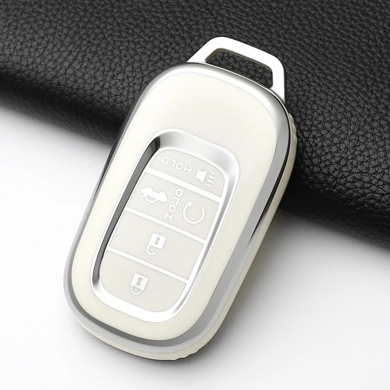 A clear silicone protective case for a car key fob showing various buttons and a key inside.