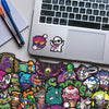 A collection of 55 colorful skull stickers featuring various designs on a laptop surface.