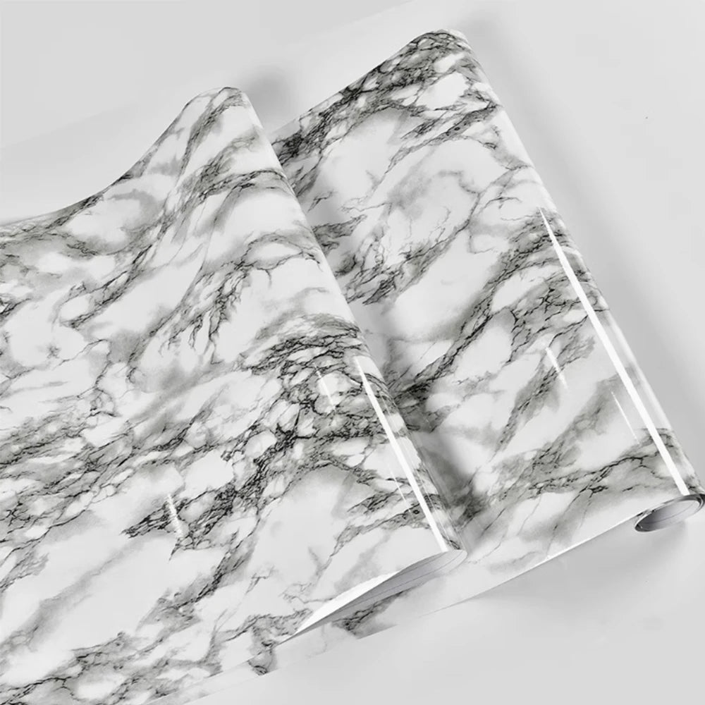 Roll of marble peel-and-stick wallpaper featuring gray and white veining