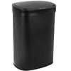 A sleek, black automatic touchless trash can with a visible sensor on the top.