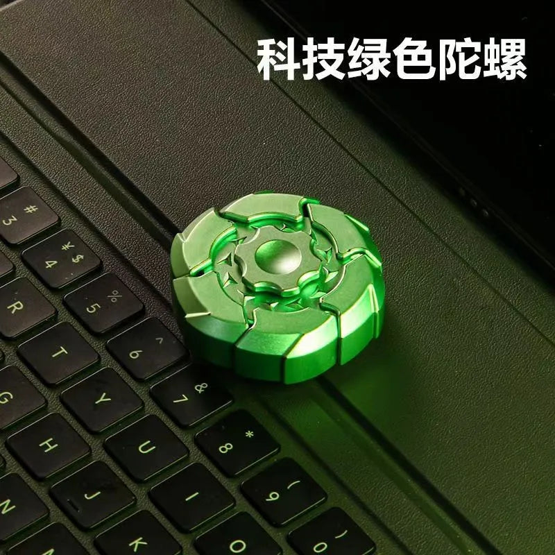 A green magnetic fidget slider is placed on a black computer keyboard.