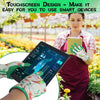 A woman wearing green gardening gloves is using a touchscreen device to interact with plants in a garden setting.