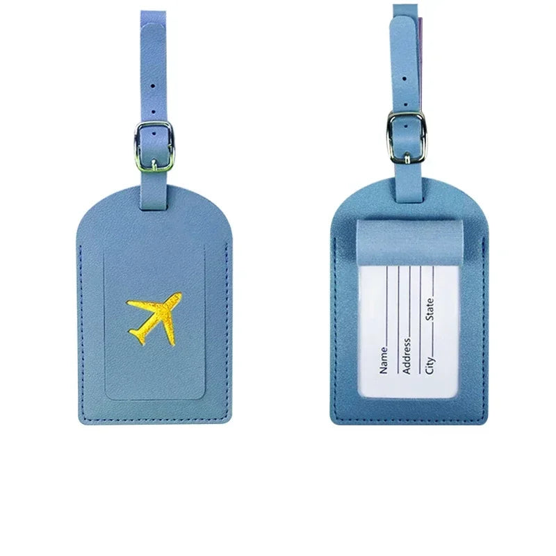A light blue PU leather luggage tag with a silver clasp and a rectangular section for personal information.
