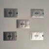 Five silver RFID protection card sleeves with geometric patterns arranged on a light gray background.