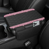 A black diamond quilted car armrest cover with a storage compartment and a clear phone holder.