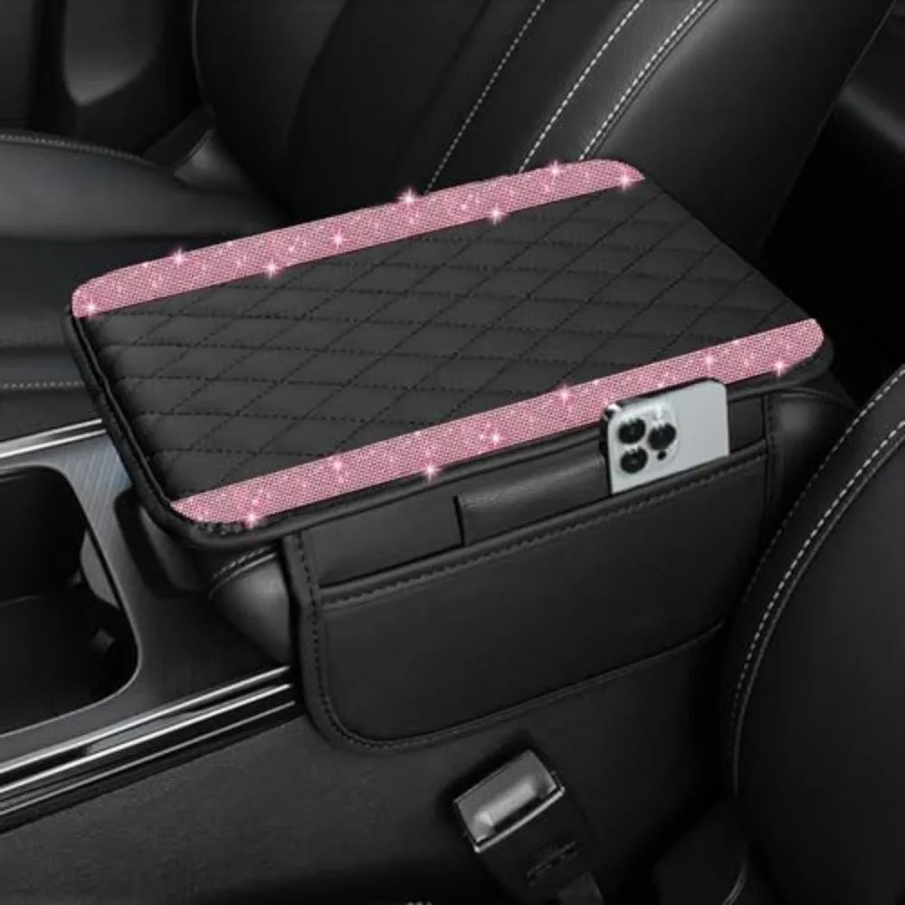 A black diamond quilted car armrest cover with a storage compartment and a clear phone holder.