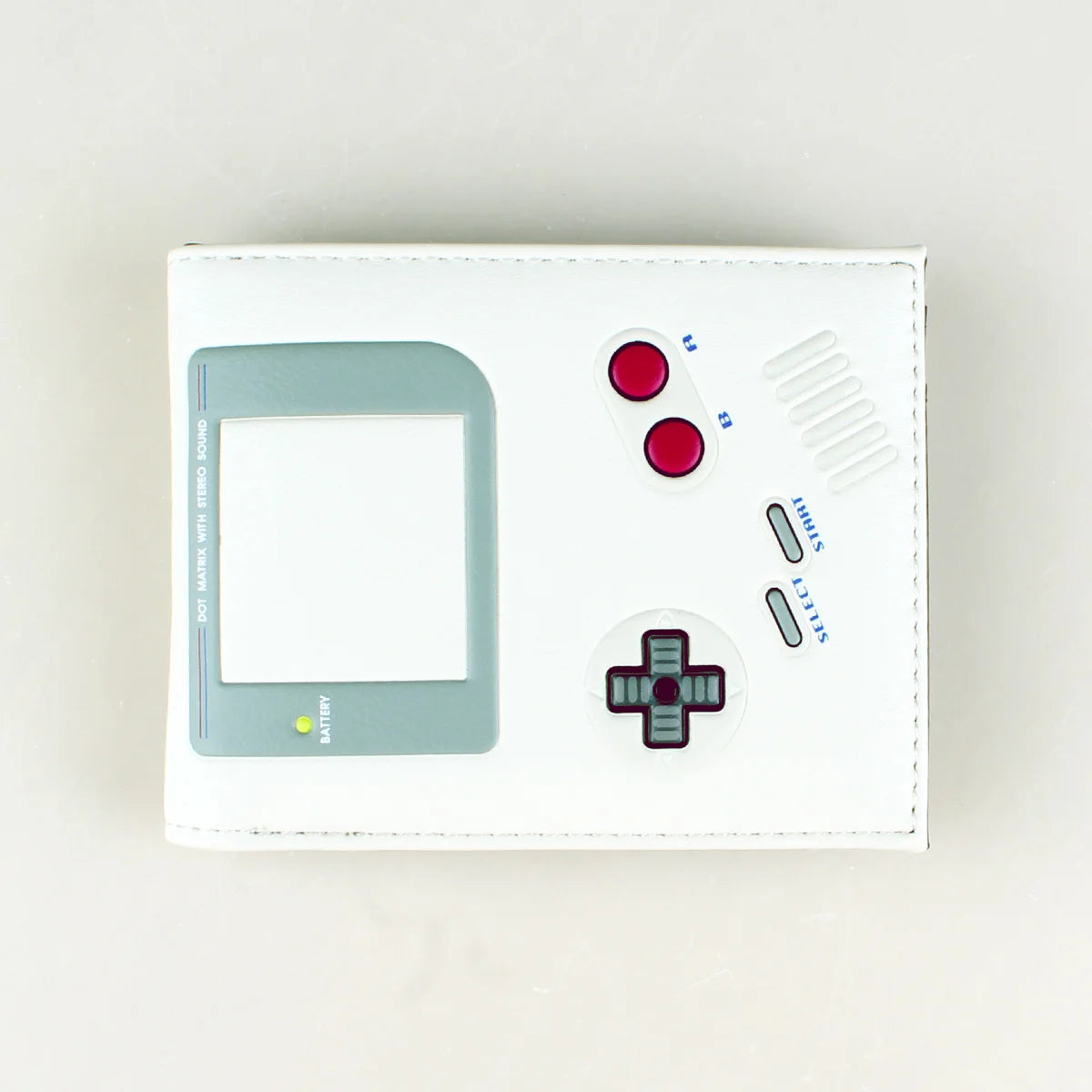 Portefeuille blanc avec emplacement rectangulaire pour console de jeu et plusieurs boutons et indicateur de batterie.