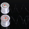 Two spools of white nylon beading cord for jewelry making with decorative labels