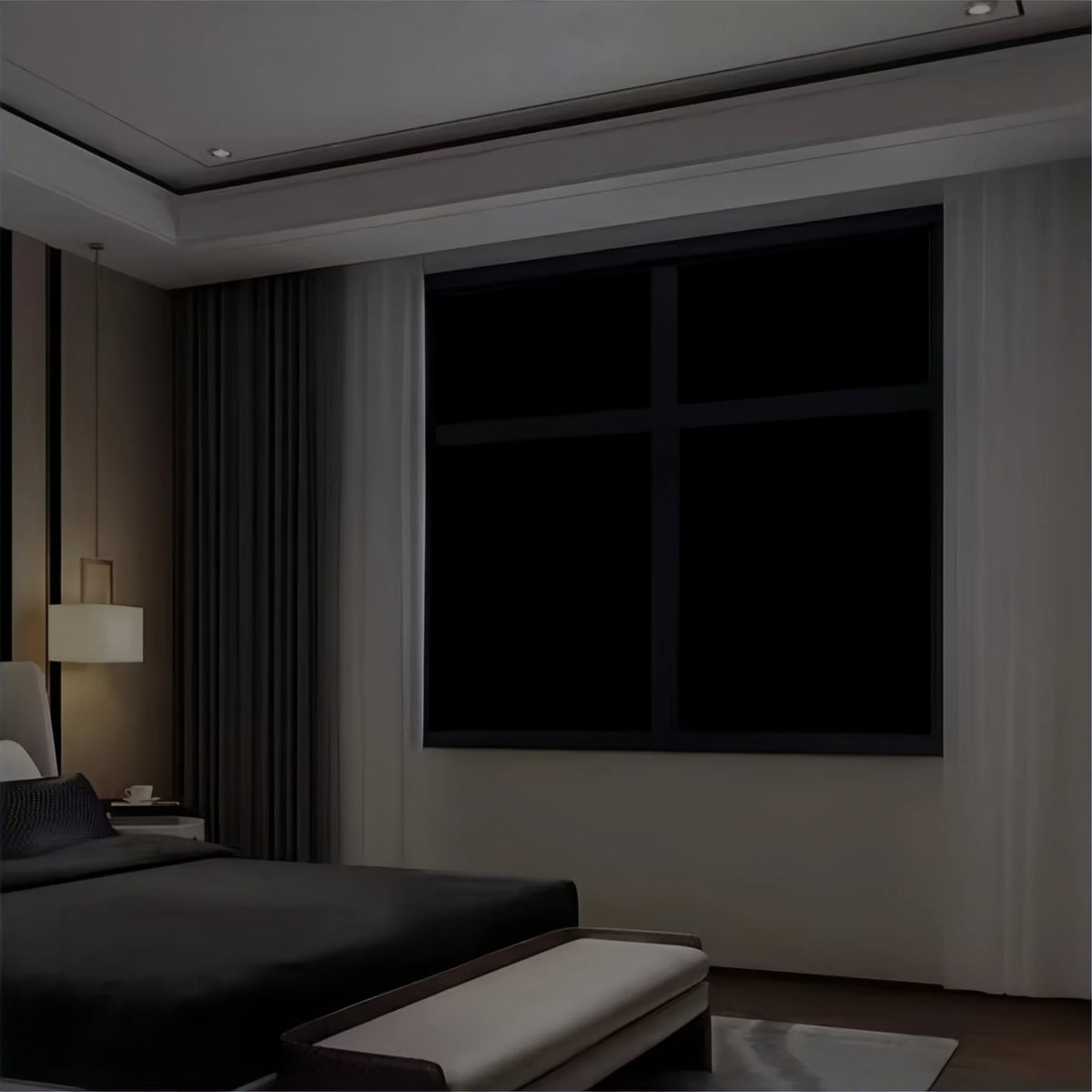 A modern bedroom interior featuring a large dark window with blackout privacy film.