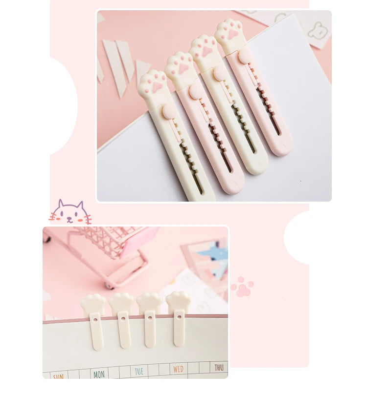 Ein Set Mini-Tierpfetzeug-Werkzeuge oder -Messer in Hellrosa und Weiß, präsentiert auf einer Oberfläche mit einem Kalender.