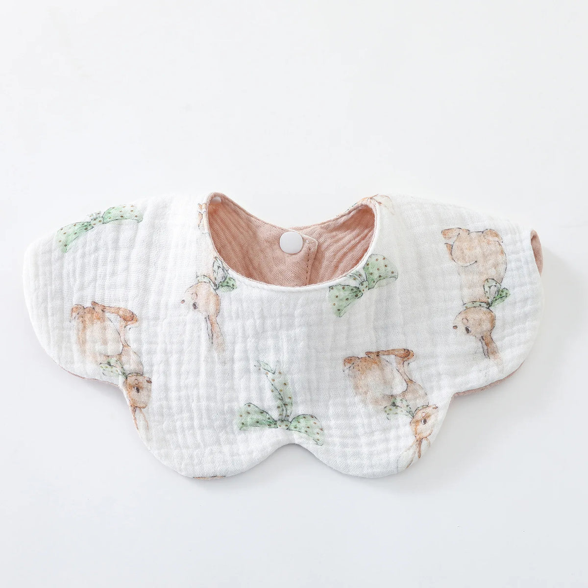 A white cotton baby feeding bib with a subtle floral pattern featuring small bear illustrations.