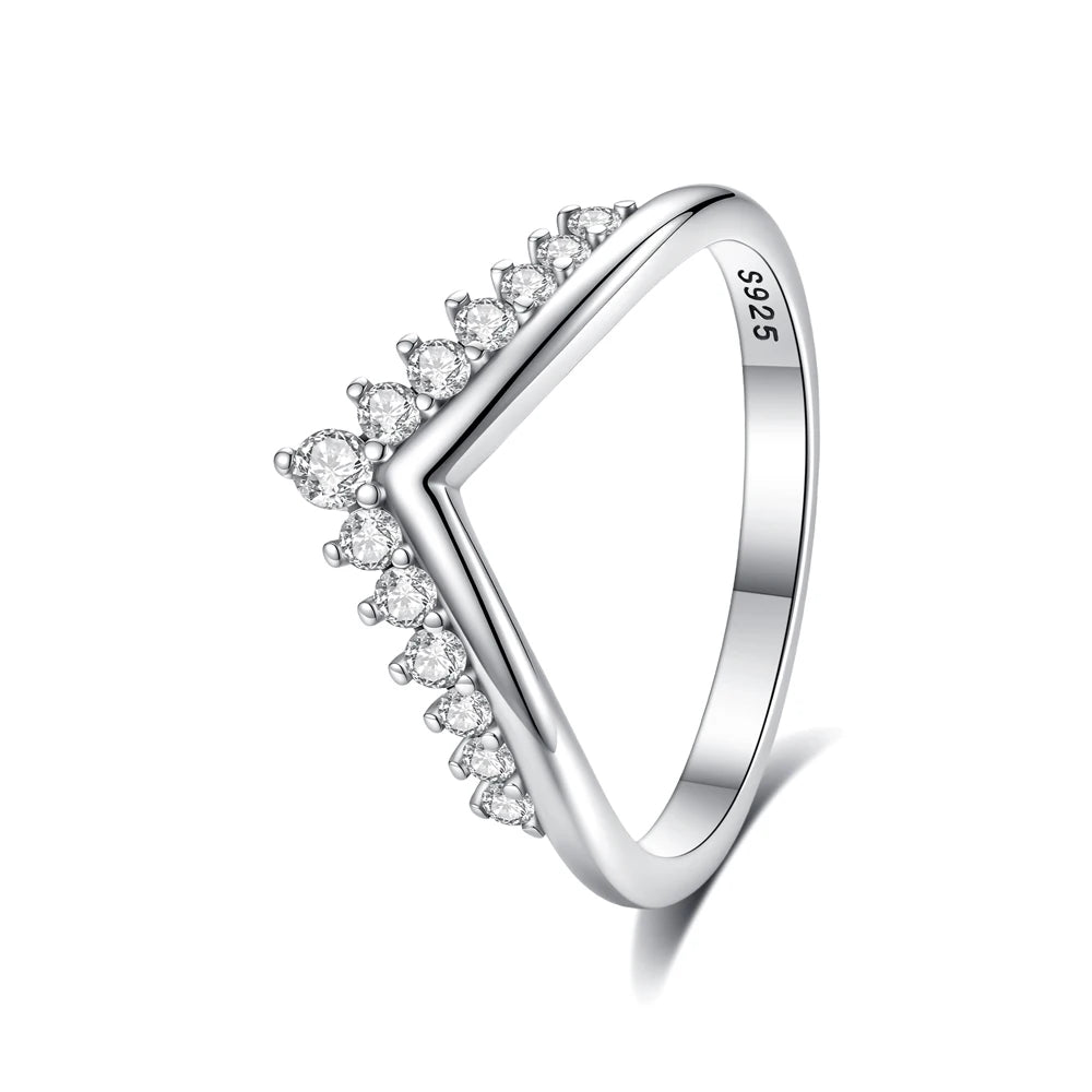 A sterling silver heart-shaped ring adorned with small cubic zirconia stones.