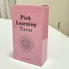 A pink box for the Pink Learning Tarot deck featuring a circular design.