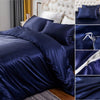 Navy blue silky duvet cover set featuring corner ties and a zipper detail.