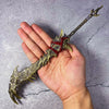 A hand holds a full-size metal katana sword inspired by Naraka: Bladepoint collectible.