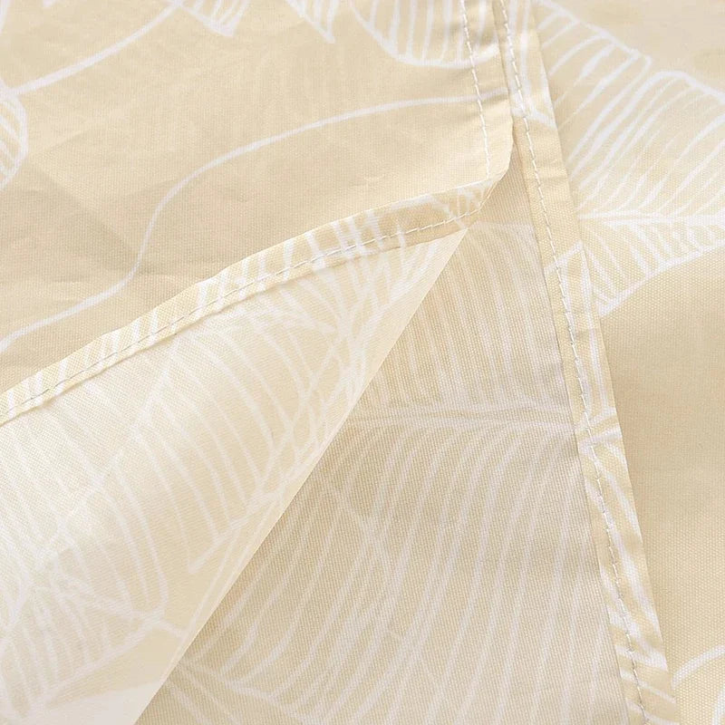 Light beige shower curtain fabric with a subtle white pattern, showing a fold and stitching detail.