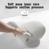 A hand is pressing a white memory foam car headrest and lumbar support cushion.