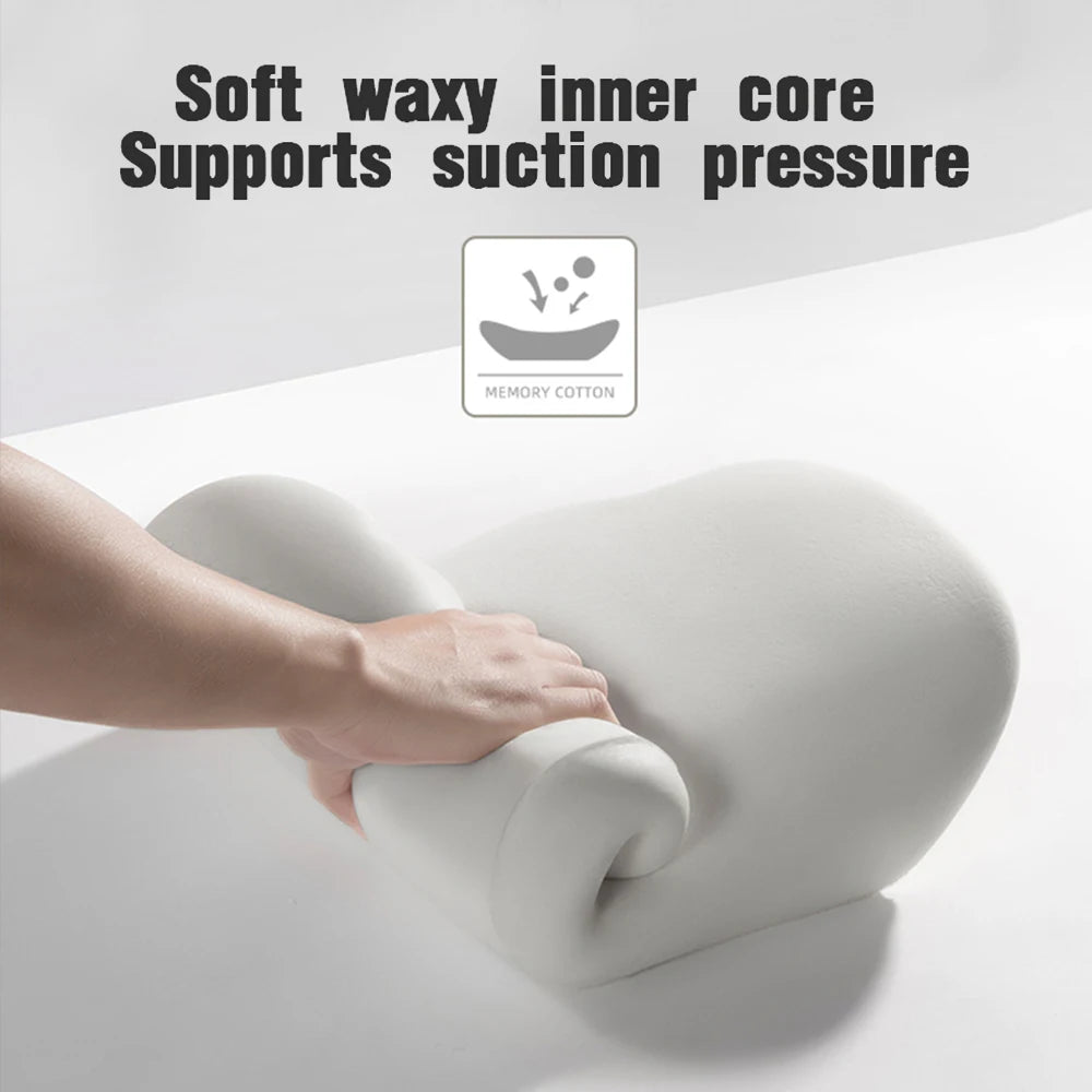 A hand is pressing a white memory foam car headrest and lumbar support cushion.
