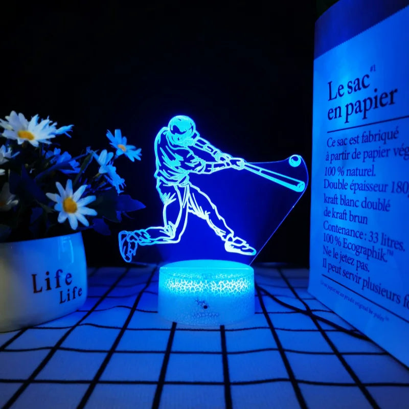 A blue 3D illusion sports night light depicting a figure in action on a clear base.