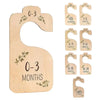 Wooden baby closet dividers with cartoon labels for age ranges 0-3 months to toddler