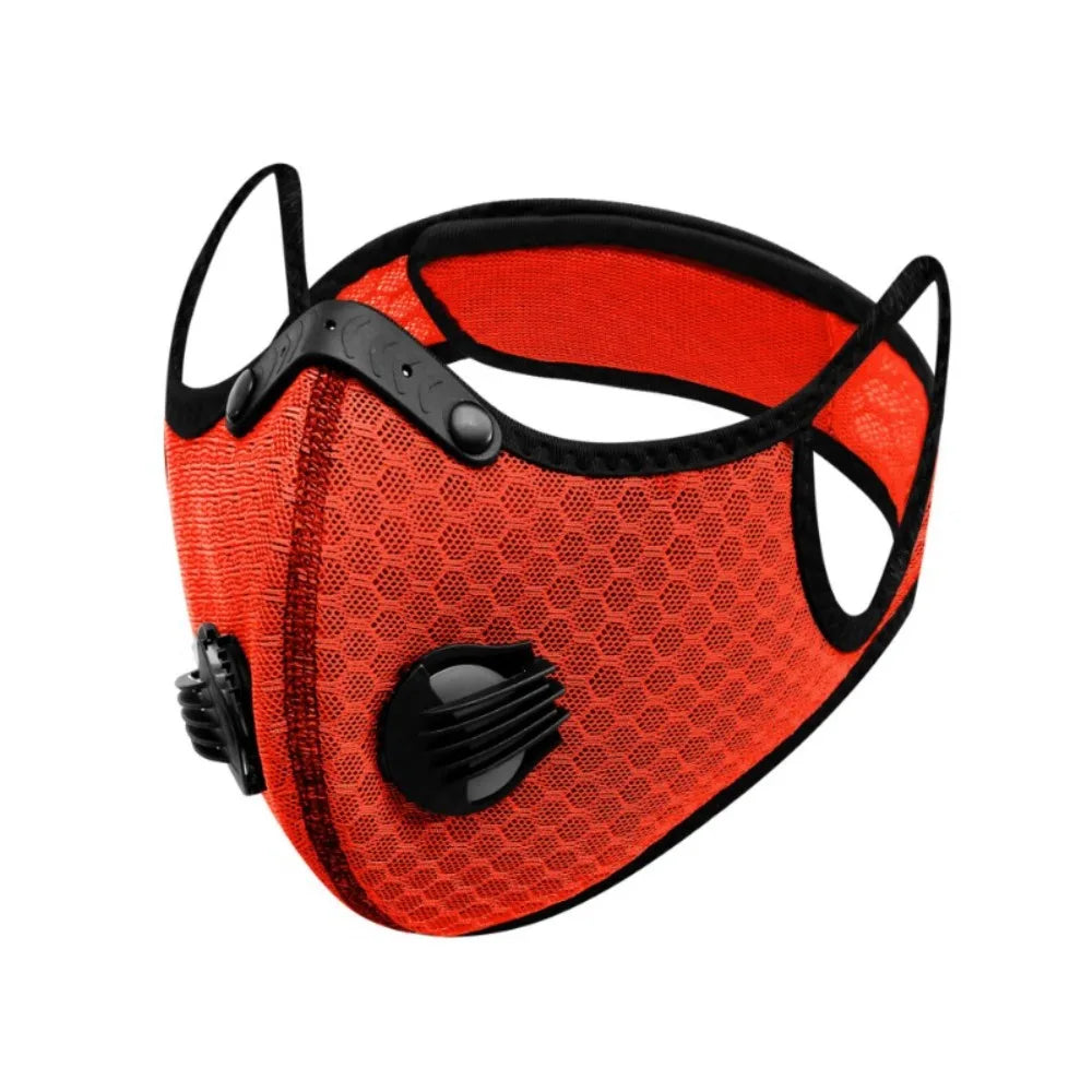 An orange reusable dust mask with black accents and a mesh filter.