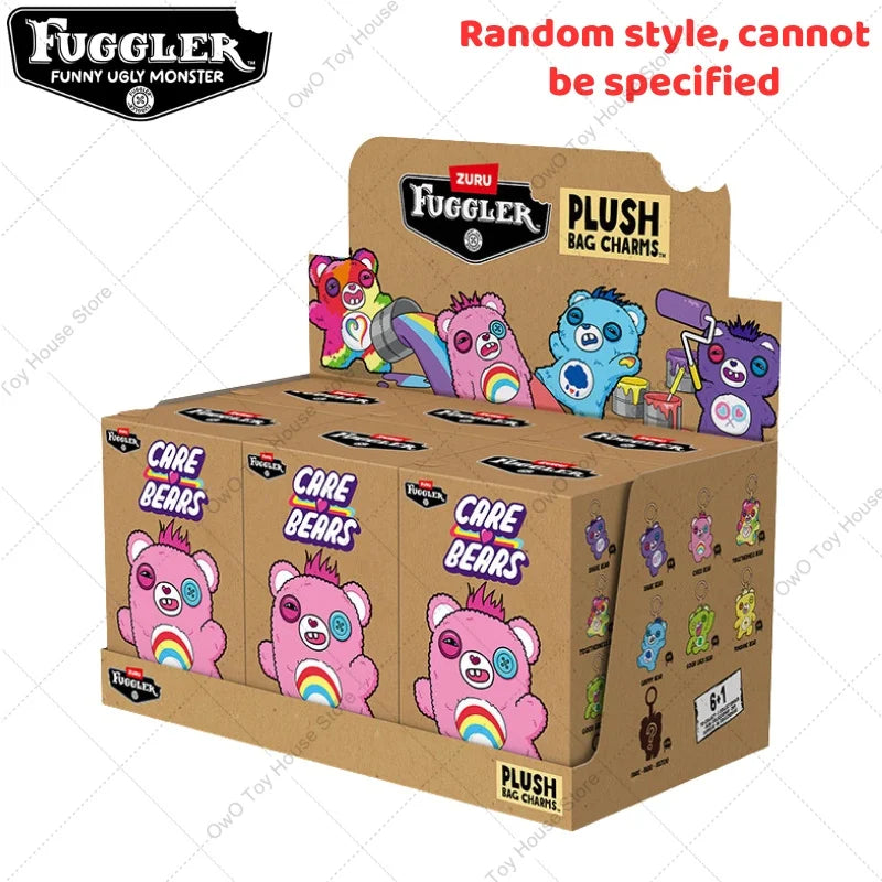 A box of Fuggler plush bag charms featuring various ugly monster characters.